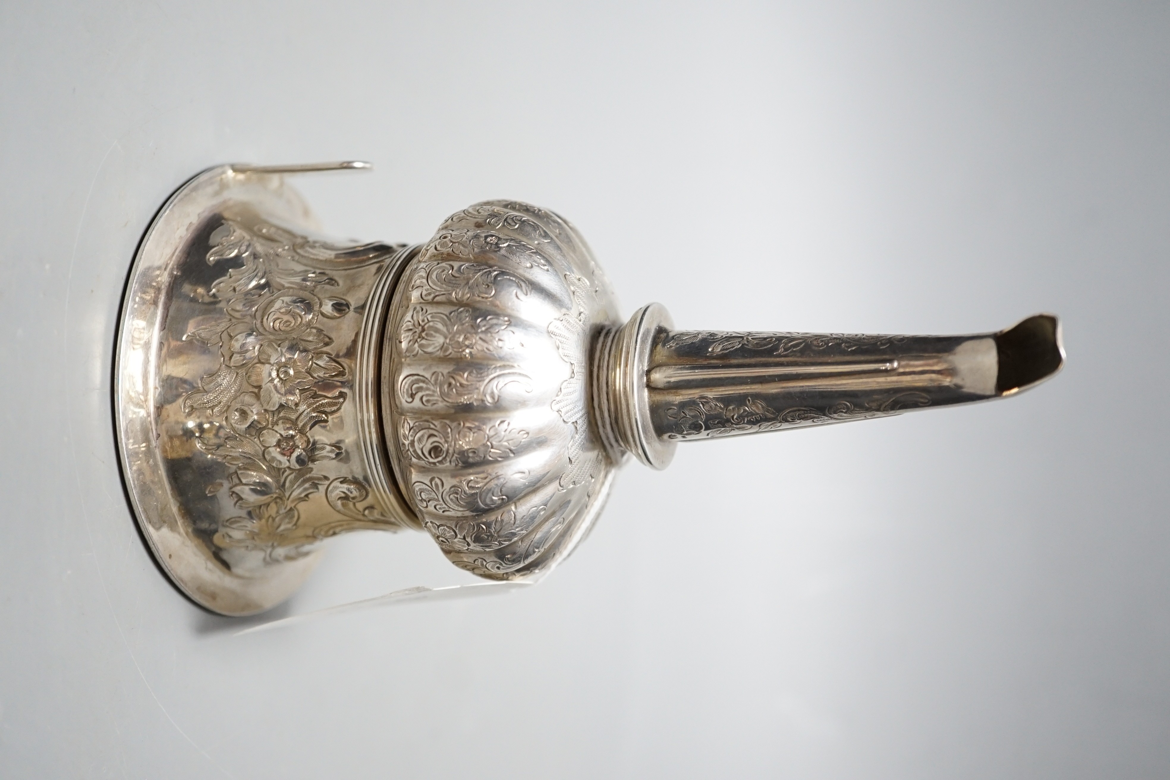 A George III silver wine funnel, with later? embossed and engraved decoration, John Watson & Son, Sheffield, 1817, 15.6cm.